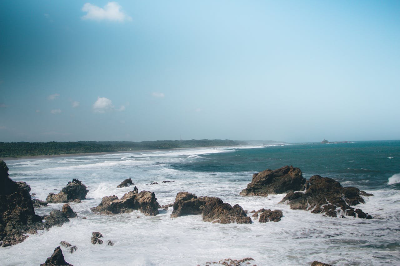 Capture the rugged beauty and dynamic waves of Tasikmalaya, West Javas captivating coastline.